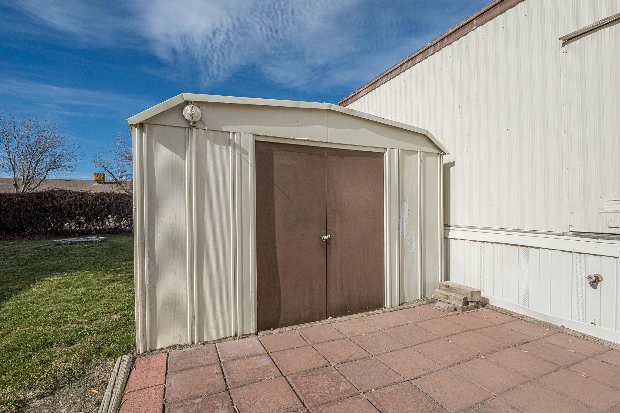 3251 E Road, Unit 22 Clifton, CO 81520 - Photo 21 of 29 a view of backyard with small cabin