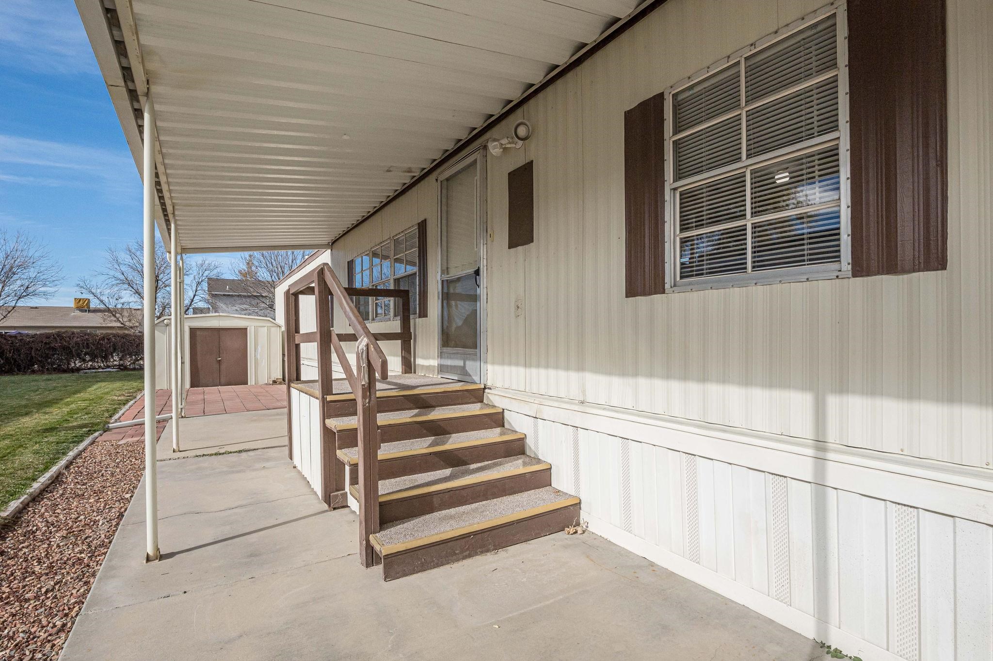 3251 E Road, Unit 22 Clifton, CO 81520 - Photo 23 of 29 a view of a house with a backyard