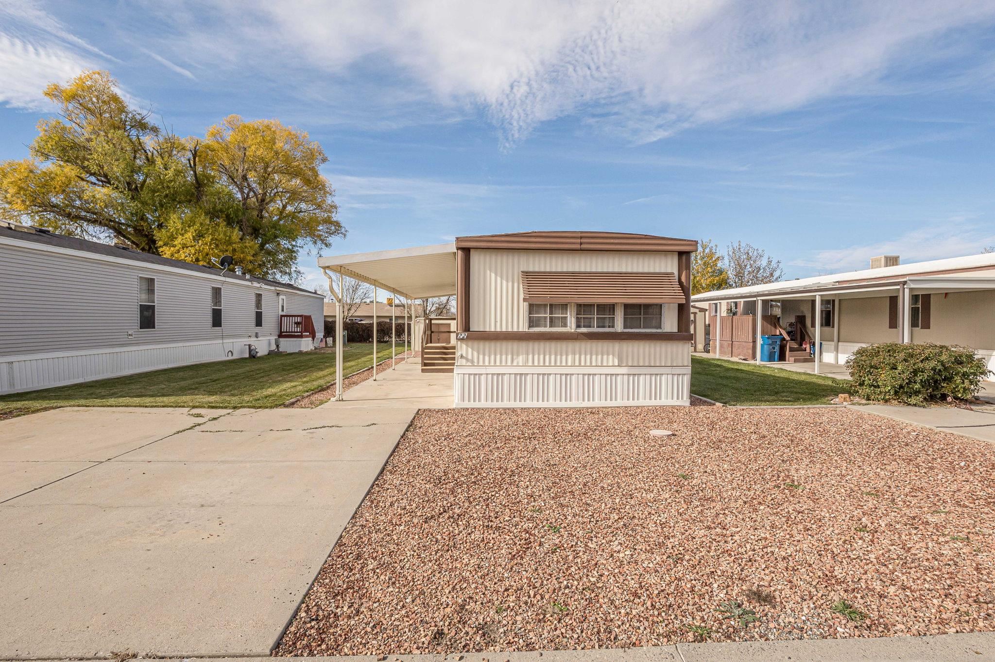 3251 E Road, Unit 22 Clifton, CO 81520 - Photo 27 of 29 a view of a house with a yard