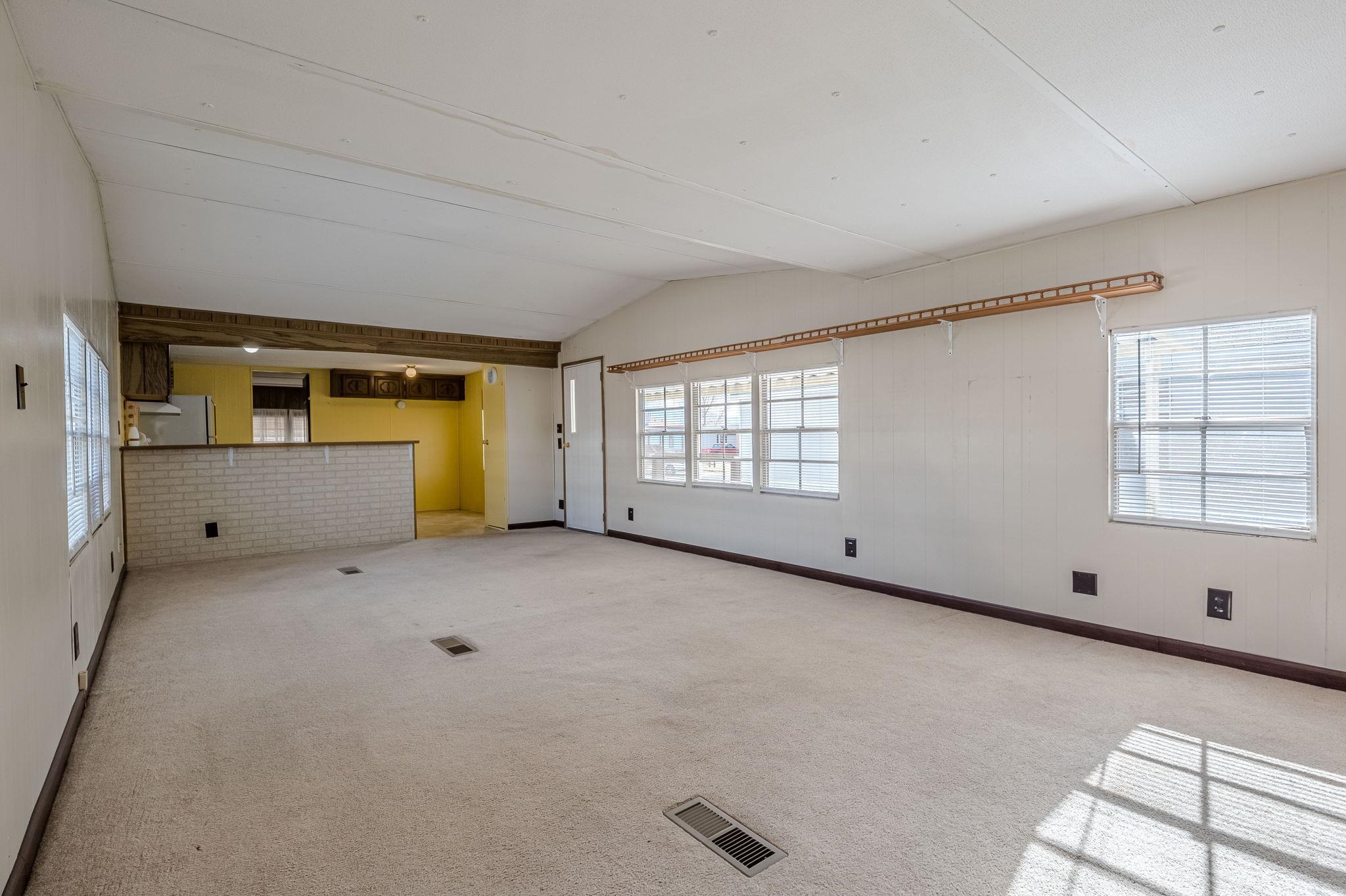 3251 E Road, Unit 22 Clifton, CO 81520 - Photo 4 of 29 an empty room with windows