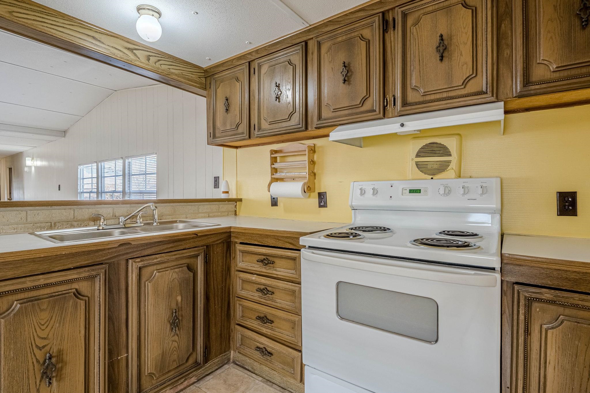 3251 E Road, Unit 22 Clifton, CO 81520 - Photo 8 of 29 a kitchen with stainless steel appliances granite countertop a sink and cabinets