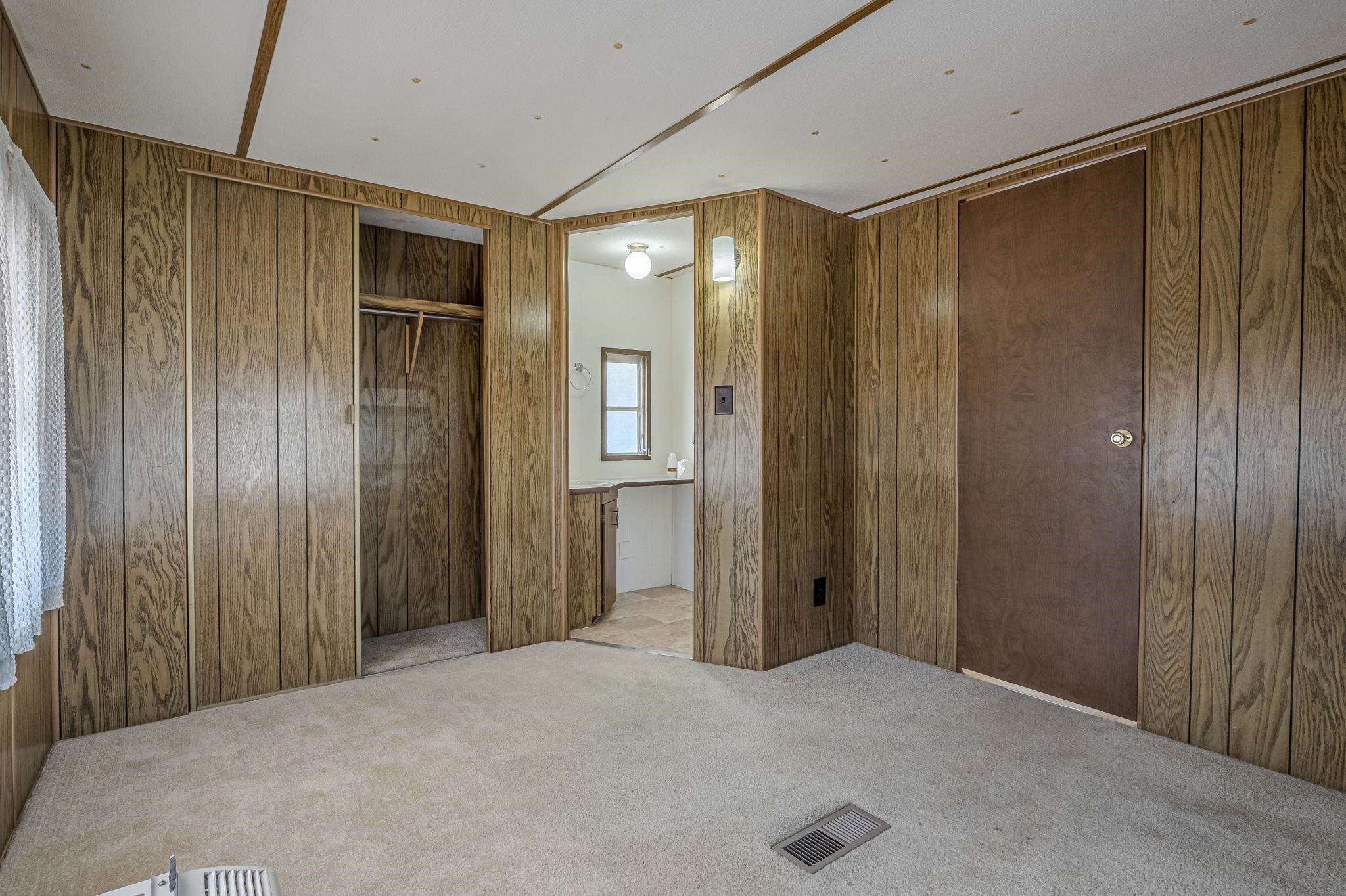 3251 E Road, Unit 22 Clifton, CO 81520 - Photo 10 of 29 a view of a hallway with wooden shelves