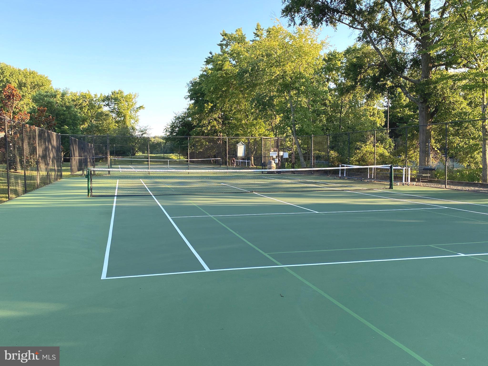 1201 Belle View Boulevard, Unit A2 Alexandria, VA 22307 - Photo 15 of 18 a tennis court with trees in the background