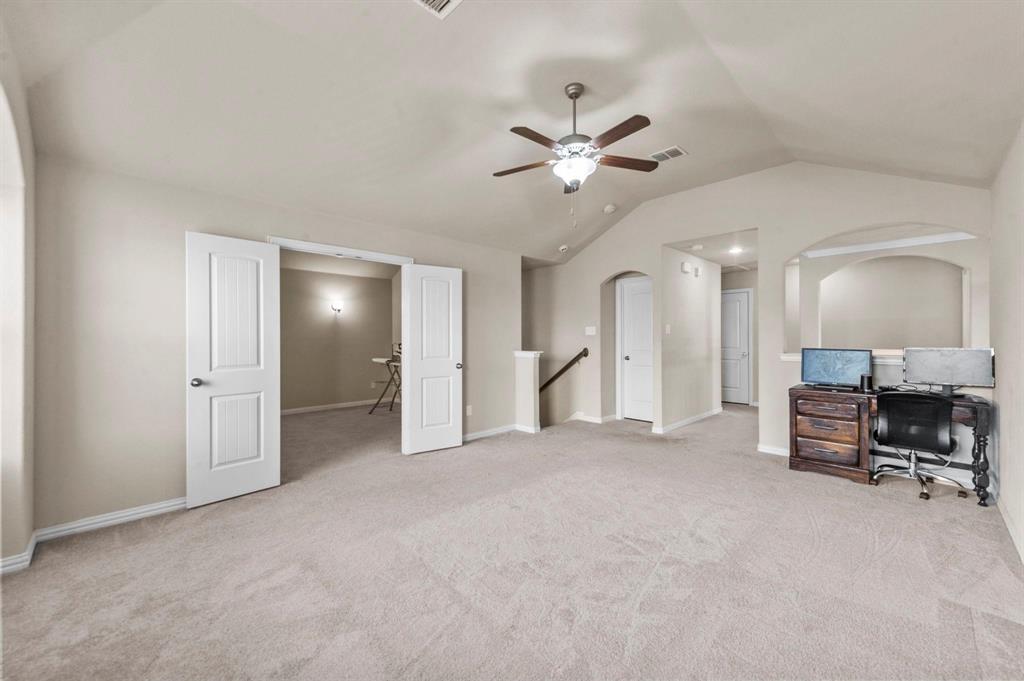 11620 Beach Street Frisco, TX 75036 - Photo 13 of 28 a view of a livingroom with a furniture and a ceiling fan
