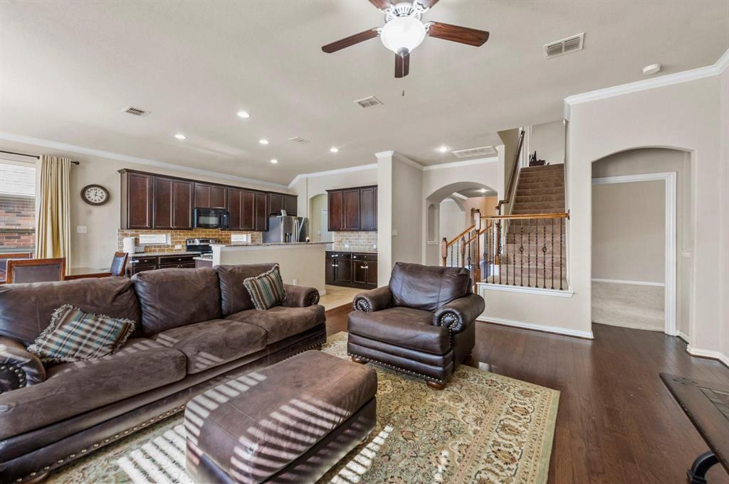 11620 Beach Street Frisco, TX 75036 - Photo 21 of 28 a living room with furniture and a wooden floor