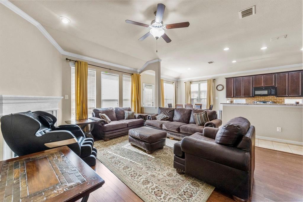 11620 Beach Street Frisco, TX 75036 - Photo 23 of 28 a living room with furniture ceiling fan and a rug