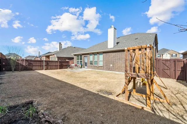 a house view with a swimming pool and a yard