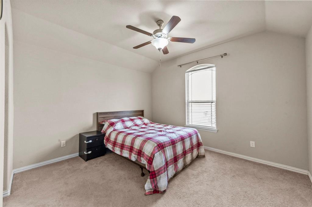 11620 Beach Street Frisco, TX 75036 - Photo 6 of 28 a bed sitting in a bedroom next to a window