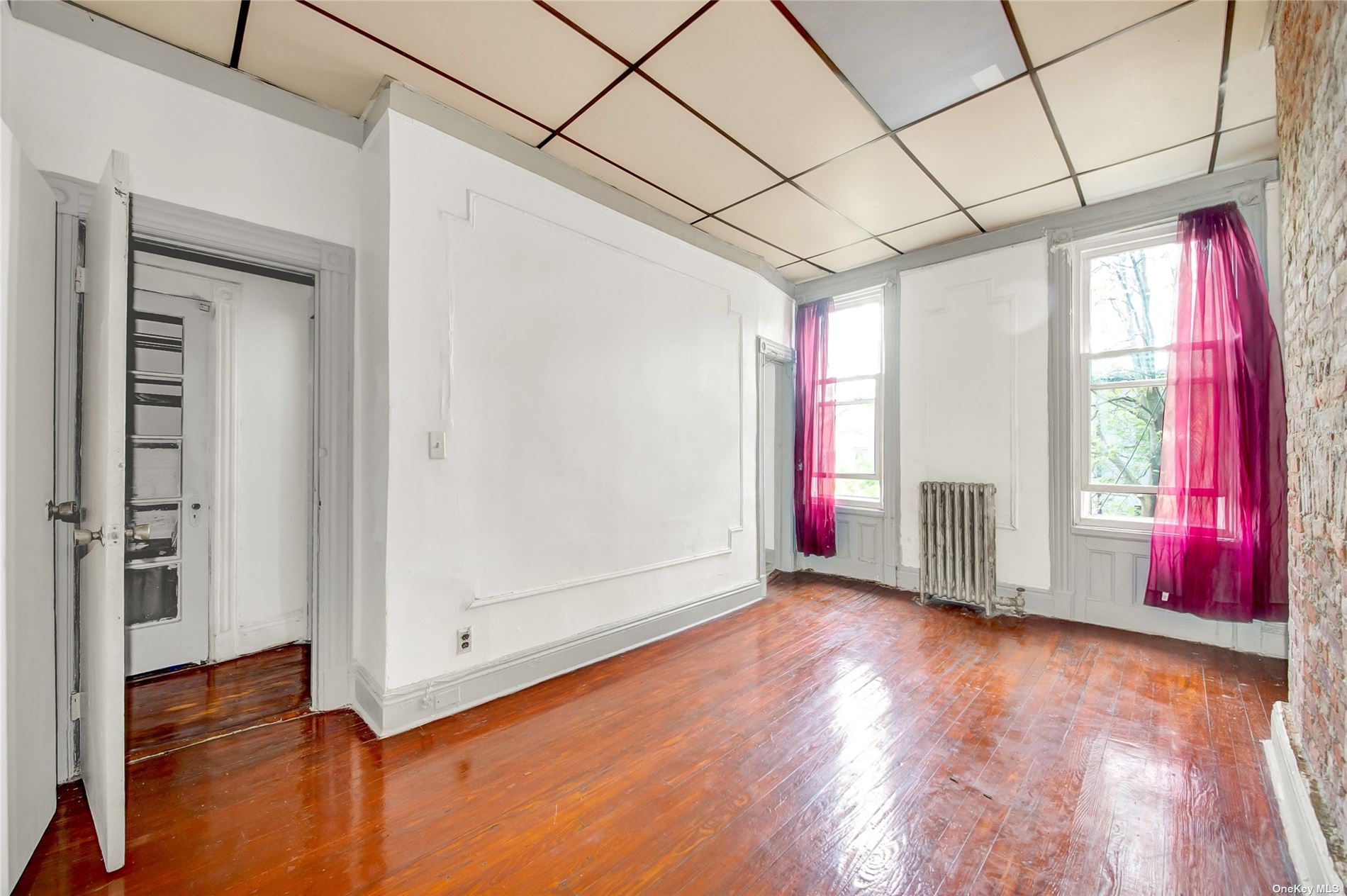 20 Weirfield Street Brooklyn, NY 11221 - Photo 11 of 12 a view of entryway with wooden floor