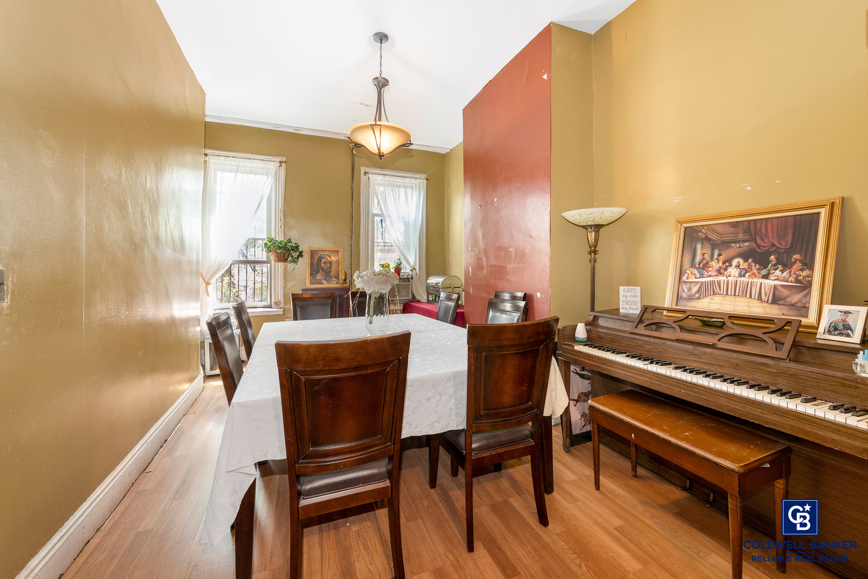 20 Weirfield Street Brooklyn, NY 11221 - Photo 4 of 12 a view of a dining room with furniture and a chandelier