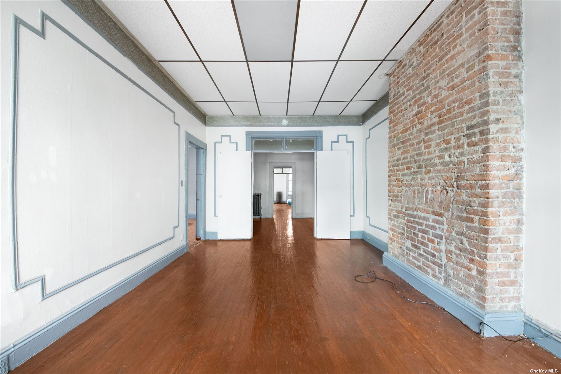 20 Weirfield Street Brooklyn, NY 11221 - Photo 9 of 12 a view of empty room with wooden floor