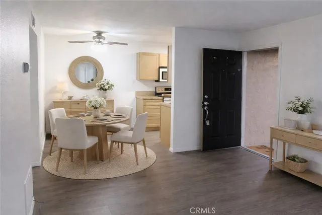 a dining room with furniture and a mirror