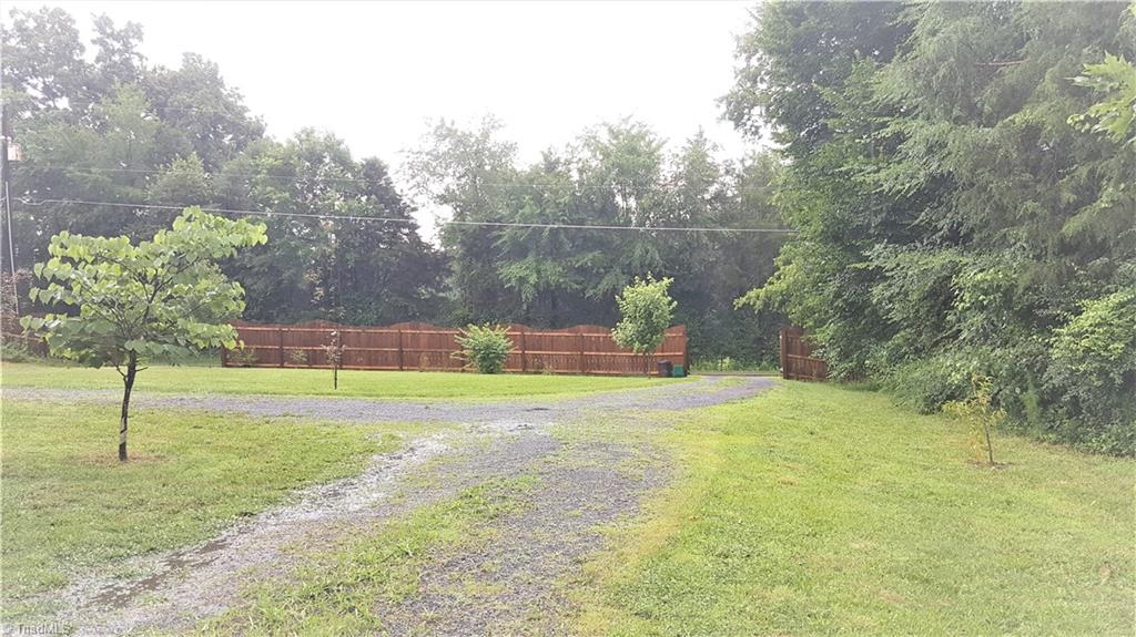 681 Juney Beauchamp Road Advance, NC 27006 - Photo 24 of 26 Privacy fencing in front with circular drive