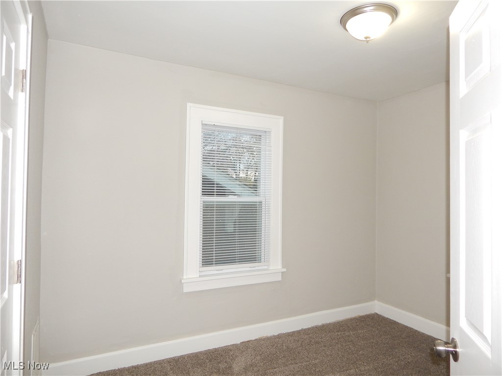 3845 Summit Park Road Cleveland Heights, OH 44121 - Photo 8 of 15 Bedroom featuring baseboards and carpet flooring