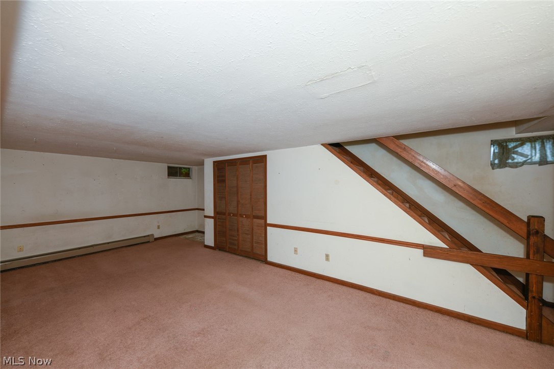 2715 Graham Road, Unit 4 Stow, OH 44224 - Photo 31 of 35 2715 Graham Rd #4, Stow, OH 44224 is an end unit condominium with 2 bedrooms, 1.5 bathrooms, 1 car garage, finished basement, laundry in lower level, huge side yard with pet fence & 3 collars provided, open floor plan from galley kitchen with oak cabinets & appliances to the large living room with wood burning fireplace, sliding glass doors to rear deck and sitting porch up front.
