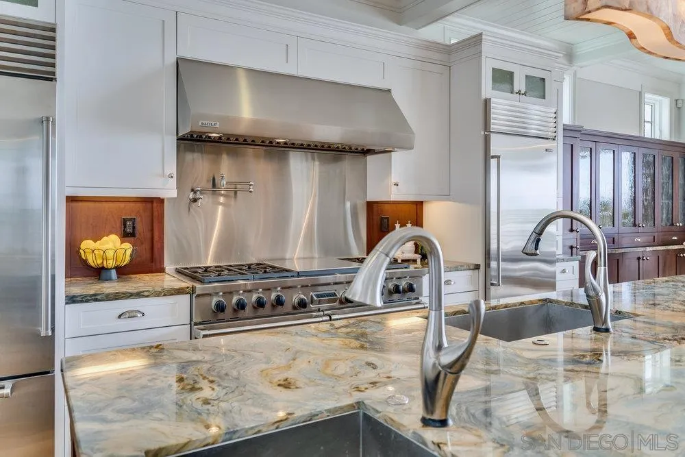 919 Ocean Boulevard Coronado, CA 92118 - Photo 13 of 63 a kitchen with a stove and a sink