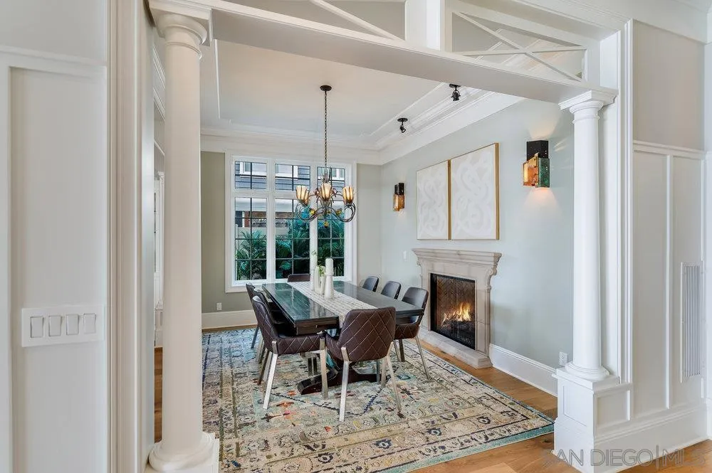 919 Ocean Boulevard Coronado, CA 92118 - Photo 16 of 63 a dining room with furniture a fireplace and wooden floor