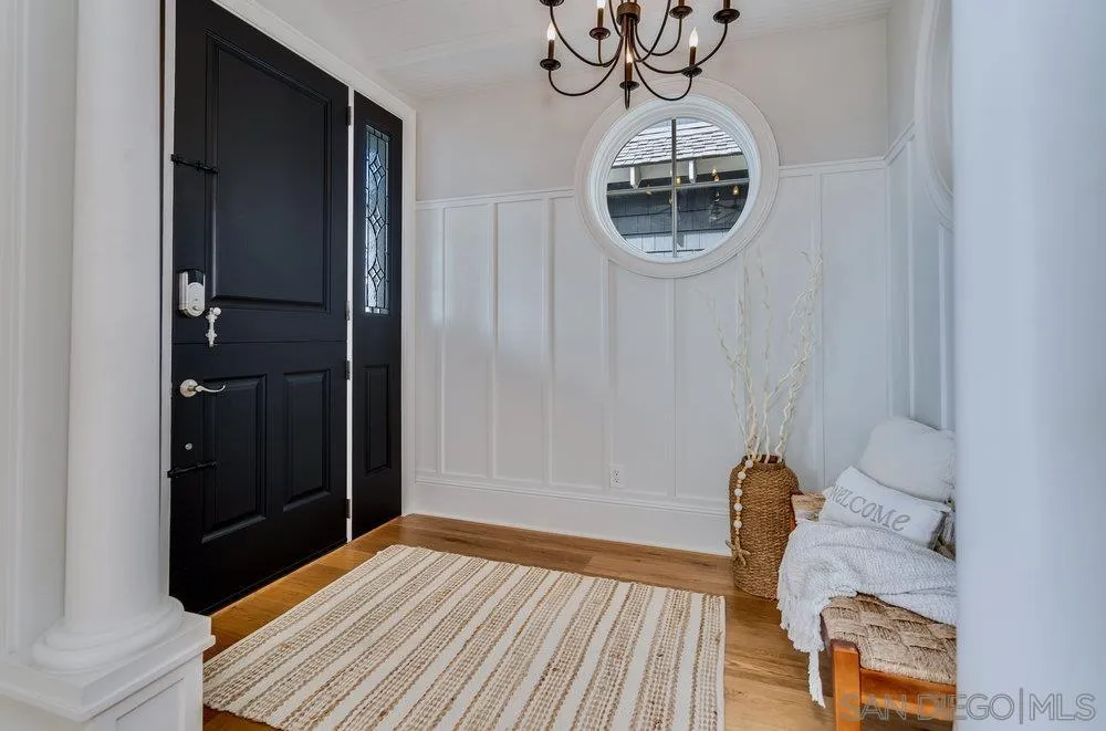 919 Ocean Boulevard Coronado, CA 92118 - Photo 20 of 63 a room with wooden floor and glass door