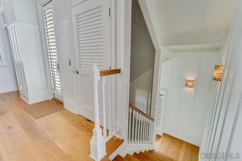 919 Ocean Boulevard Coronado, CA 92118 - Photo 43 of 63 a view of a hallway with wooden floor and cabinet