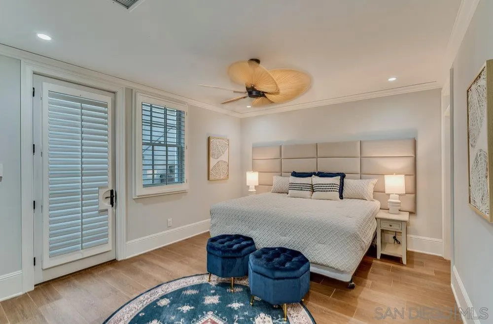 919 Ocean Boulevard Coronado, CA 92118 - Photo 49 of 63 a bedroom with a bed and wooden floor