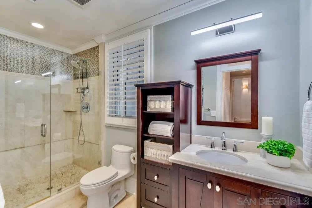 919 Ocean Boulevard Coronado, CA 92118 - Photo 50 of 63 a bathroom with a granite countertop sink toilet and shower