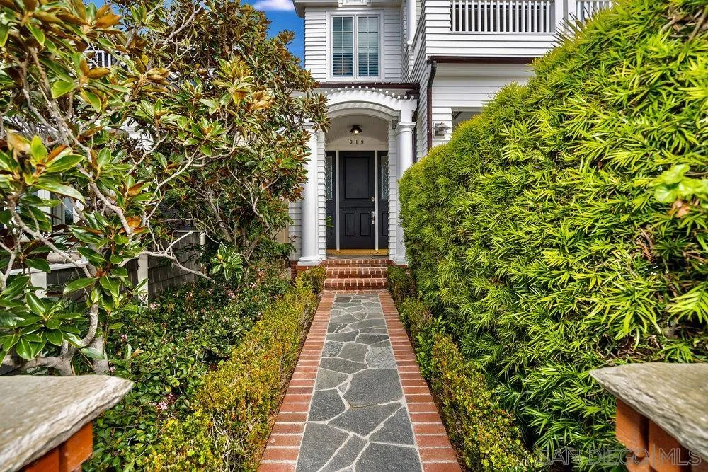919 Ocean Boulevard Coronado, CA 92118 - Photo 60 of 63 front view of a house with a garden