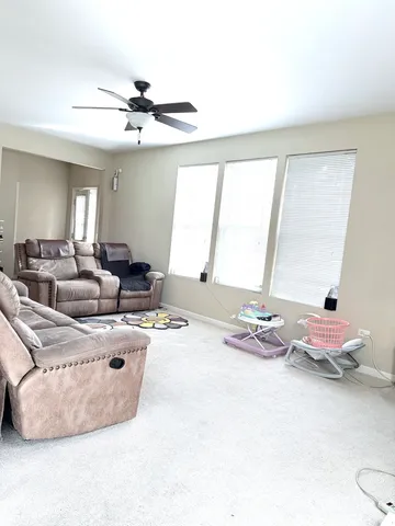 a dining room with table and chairs