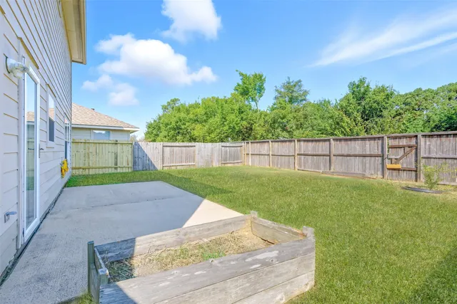 a view of a backyard with a garden