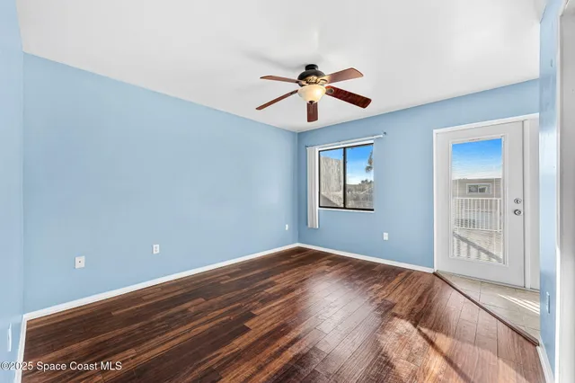 a view of room with wooden floor
