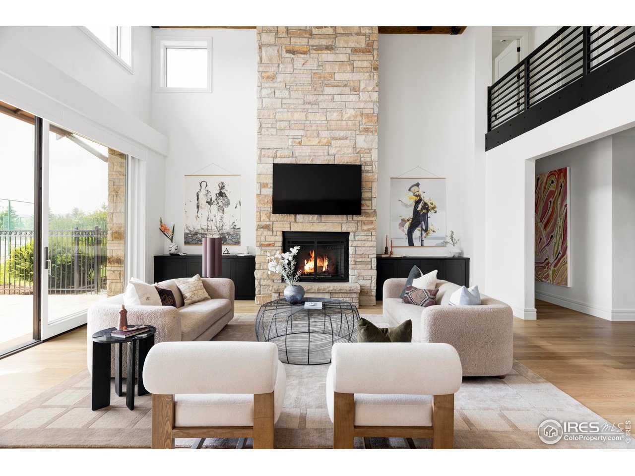 6880 St Vrain Road Longmont, CO 80503 - Photo 11 of 37 a living room with fireplace furniture and a flat screen tv
