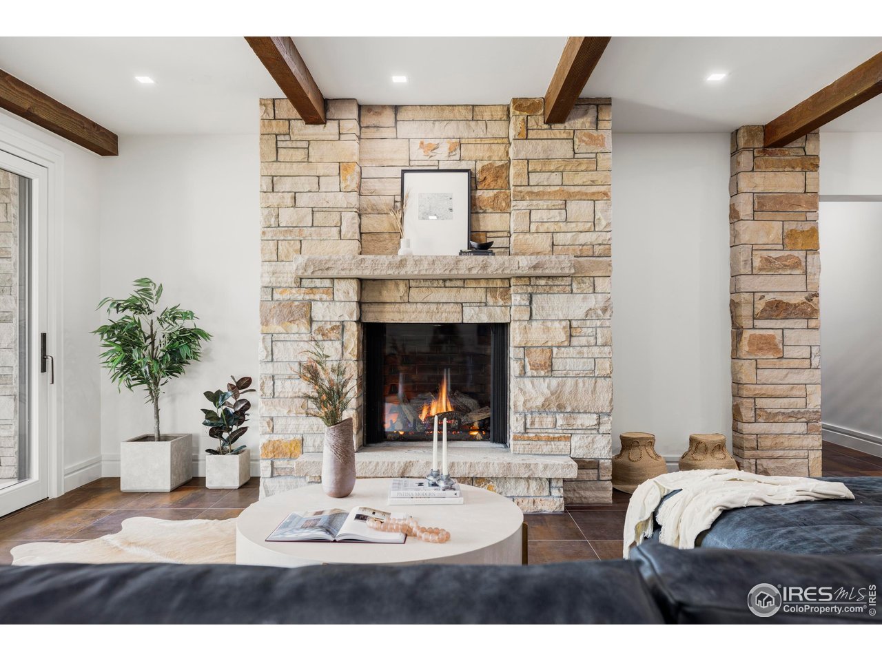6880 St Vrain Road Longmont, CO 80503 - Photo 21 of 37 a view of a livingroom with furniture and a fireplace