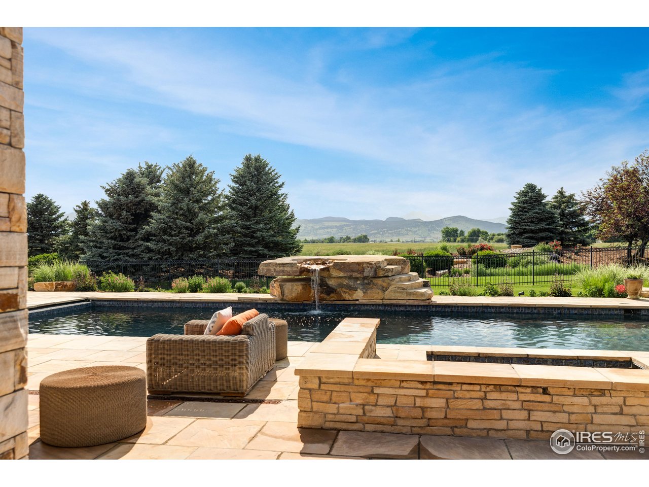 6880 St Vrain Road Longmont, CO 80503 - Photo 29 of 37 a view of swimming pool with seating area and barbeque oven