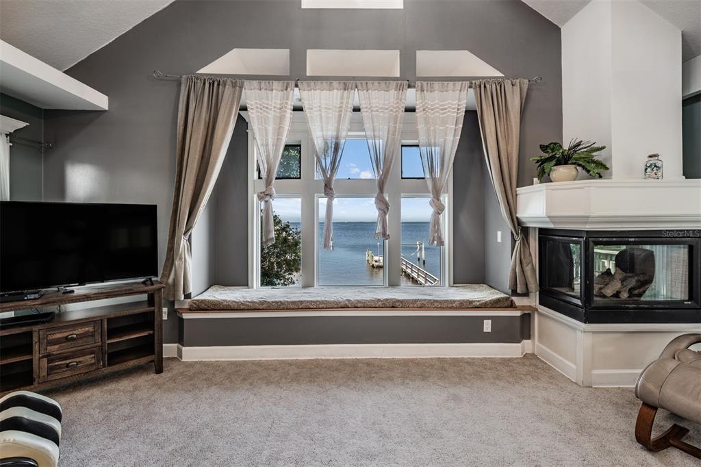 615 North Mayo Street Palm Harbor, FL 34683 - Photo 11 of 73 a living room with furniture and a flat screen tv