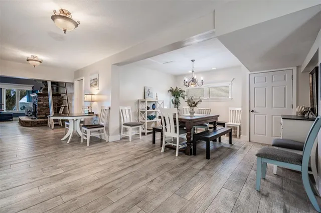 a kitchen with stainless steel appliances granite countertop a stove refrigerator and cabinets