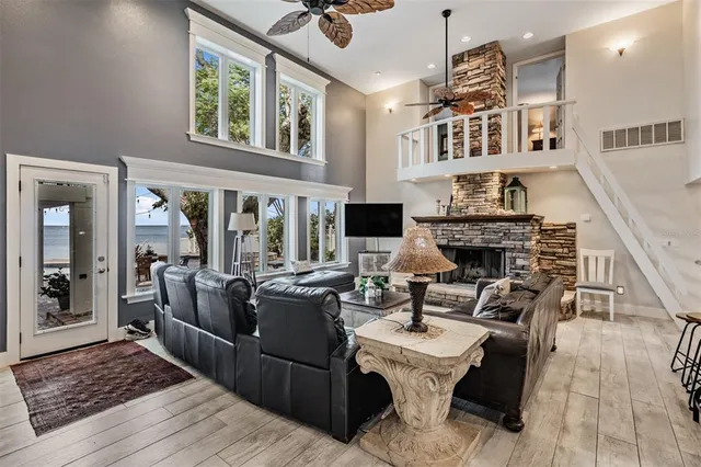 a spacious bathroom with a granite countertop sink a mirror and a bathtub