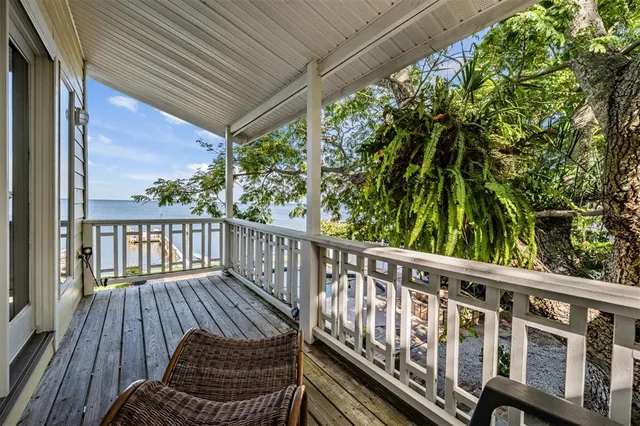 a front view of a house with a yard table and chairs