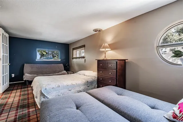 a view of a house with swimming pool and sitting area