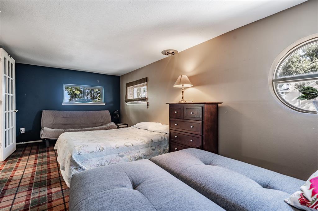 615 North Mayo Street Palm Harbor, FL 34683 - Photo 37 of 73 a bedroom with a bed and a dresser