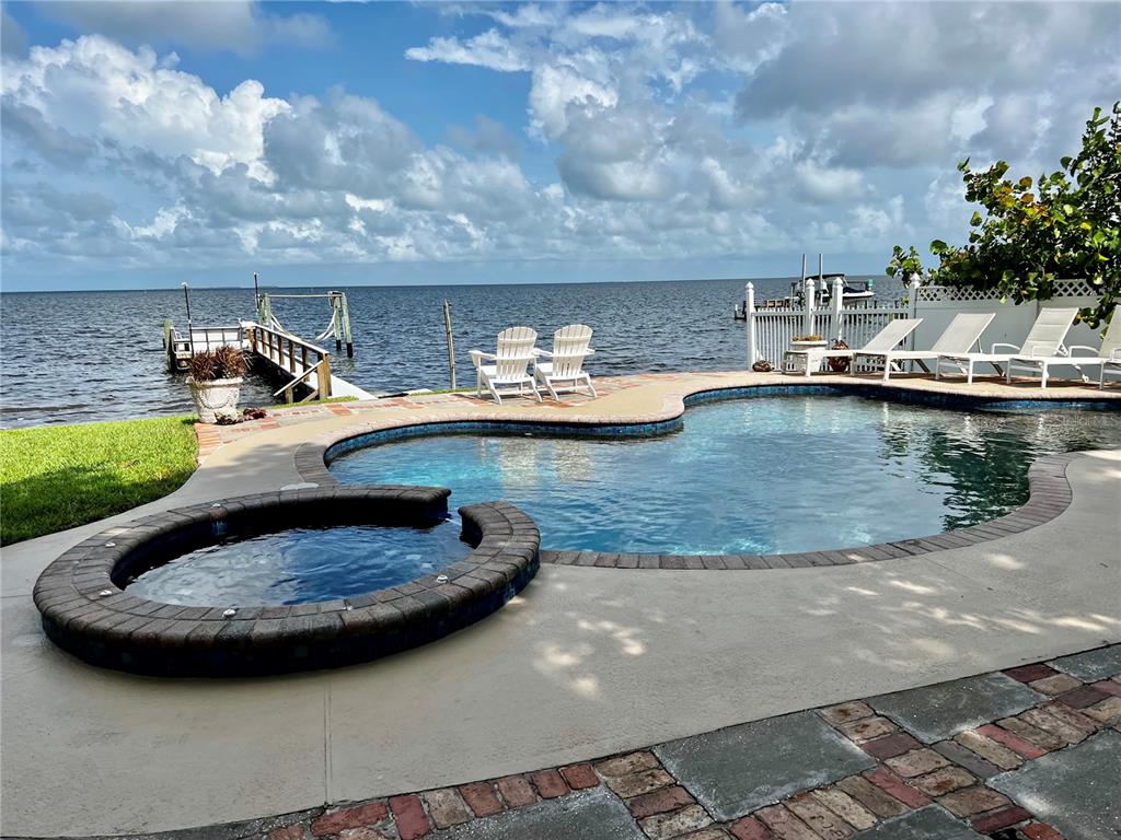 615 North Mayo Street Palm Harbor, FL 34683 - Photo 6 of 73 a view of a swimming pool with a yard