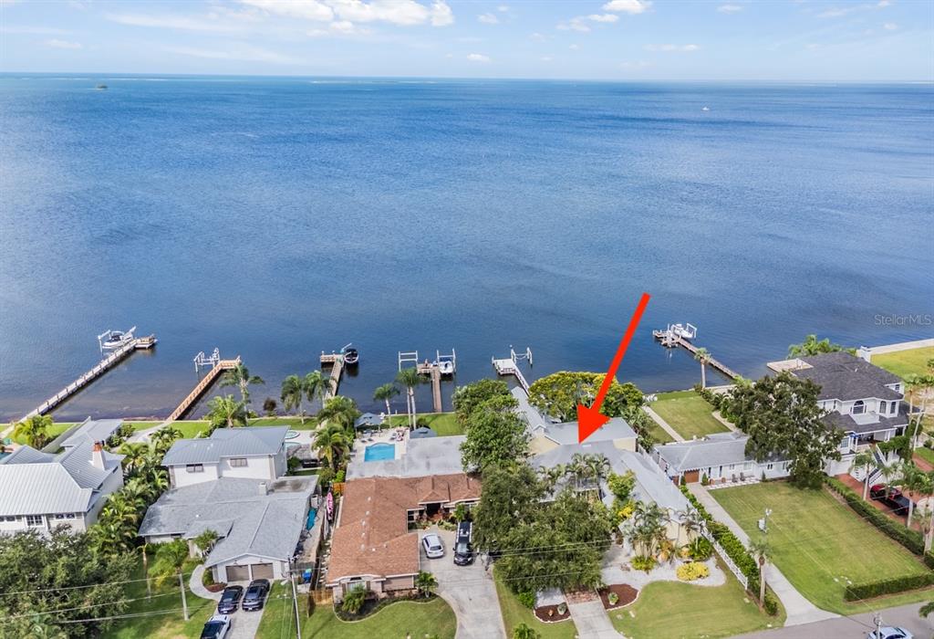 615 North Mayo Street Palm Harbor, FL 34683 - Photo 62 of 73 an aerial view of a house with a yard and potted plants