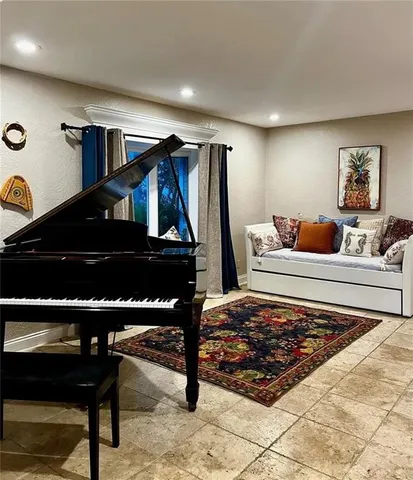 a kitchen with stainless steel appliances granite countertop a sink a stove and a refrigerator