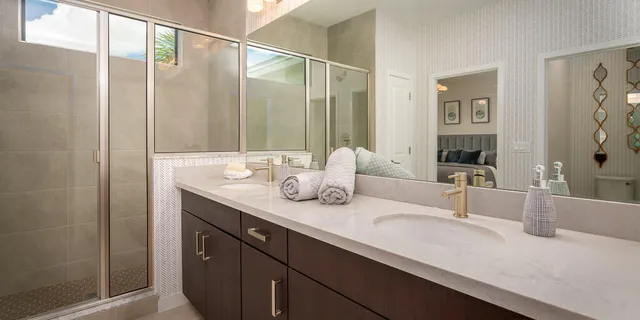 a bathroom with a double vanity sink and a mirror