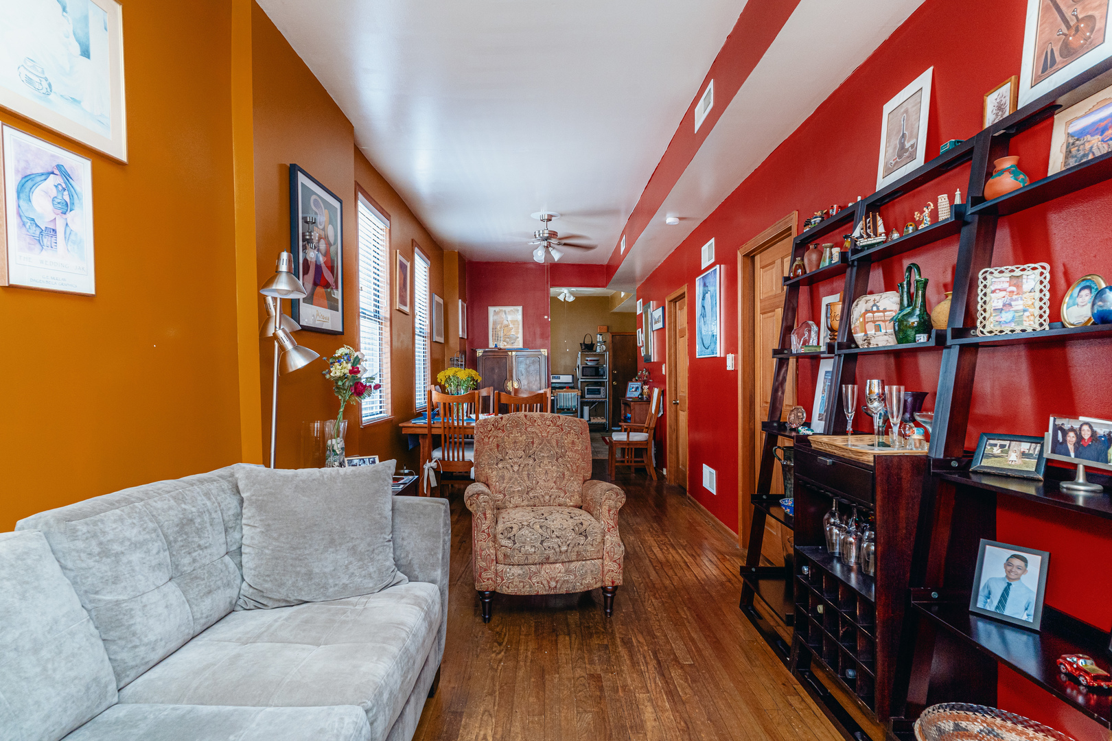 747 North Throop Street Chicago, IL 60642 - Photo 21 of 31 a living room with furniture and a book shelf