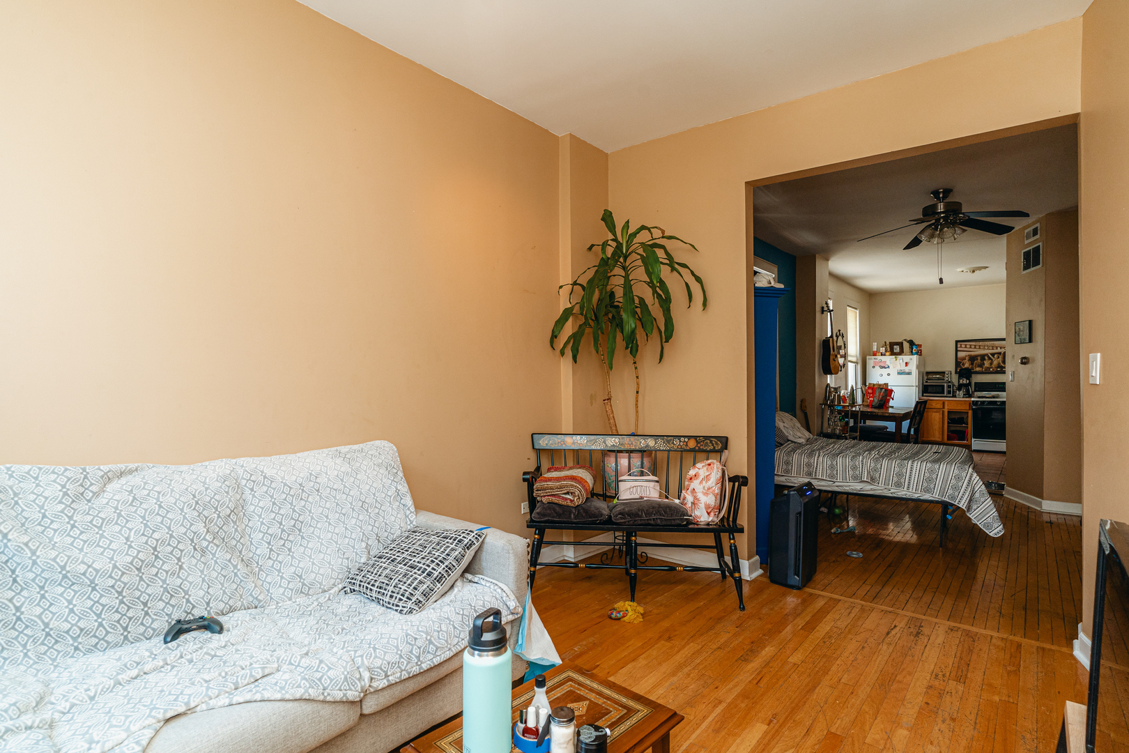 747 North Throop Street Chicago, IL 60642 - Photo 8 of 31 a living room with furniture and a dining table with wooden floor