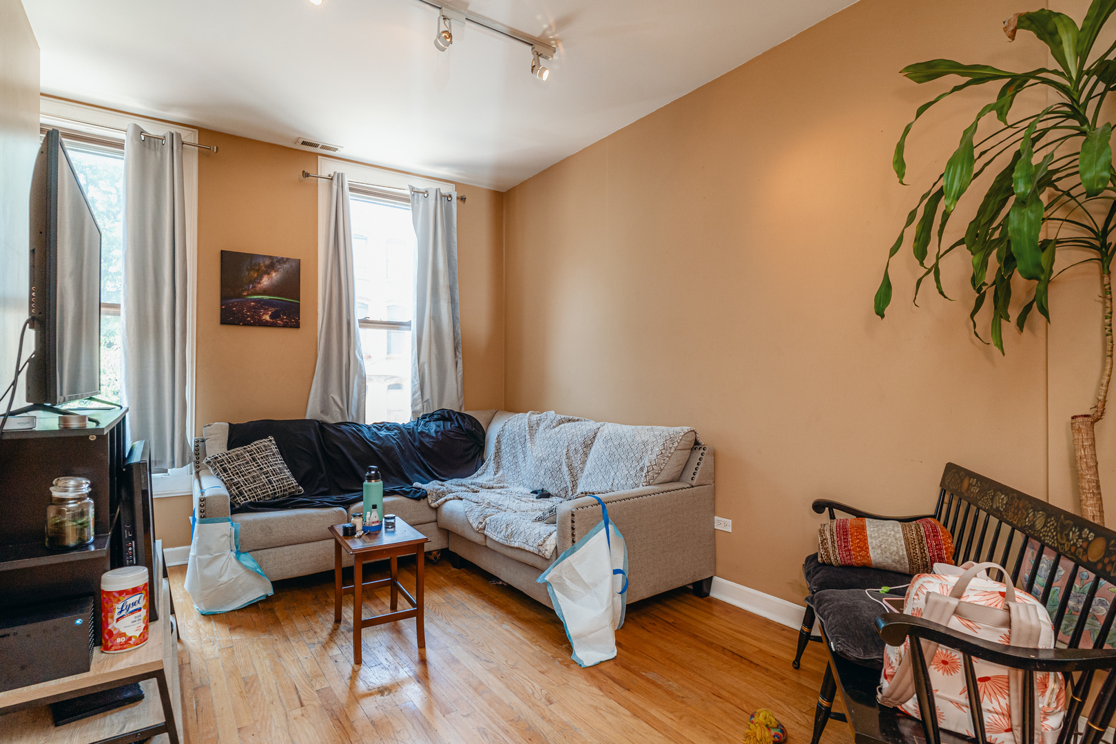 747 North Throop Street Chicago, IL 60642 - Photo 9 of 31 a living room with furniture and a flat screen tv