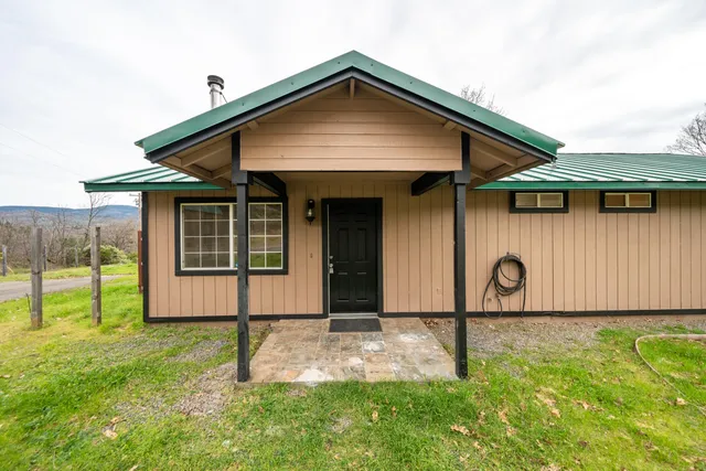 a room with wooden floors and wooden cabinets