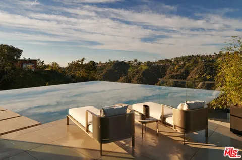 a view of a terrace with sitting area