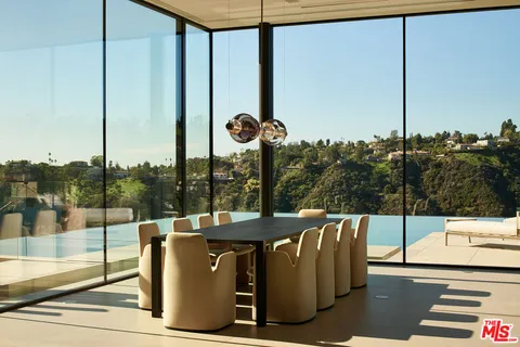 a view of a balcony with floor to ceiling windows