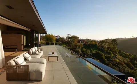 a view of balcony with furniture