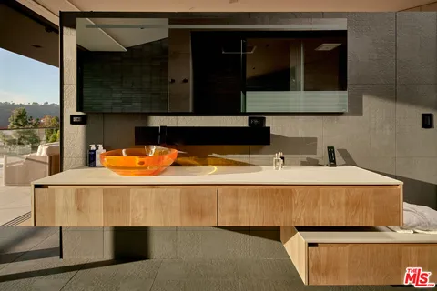 a kitchen with a sink and a refrigerator